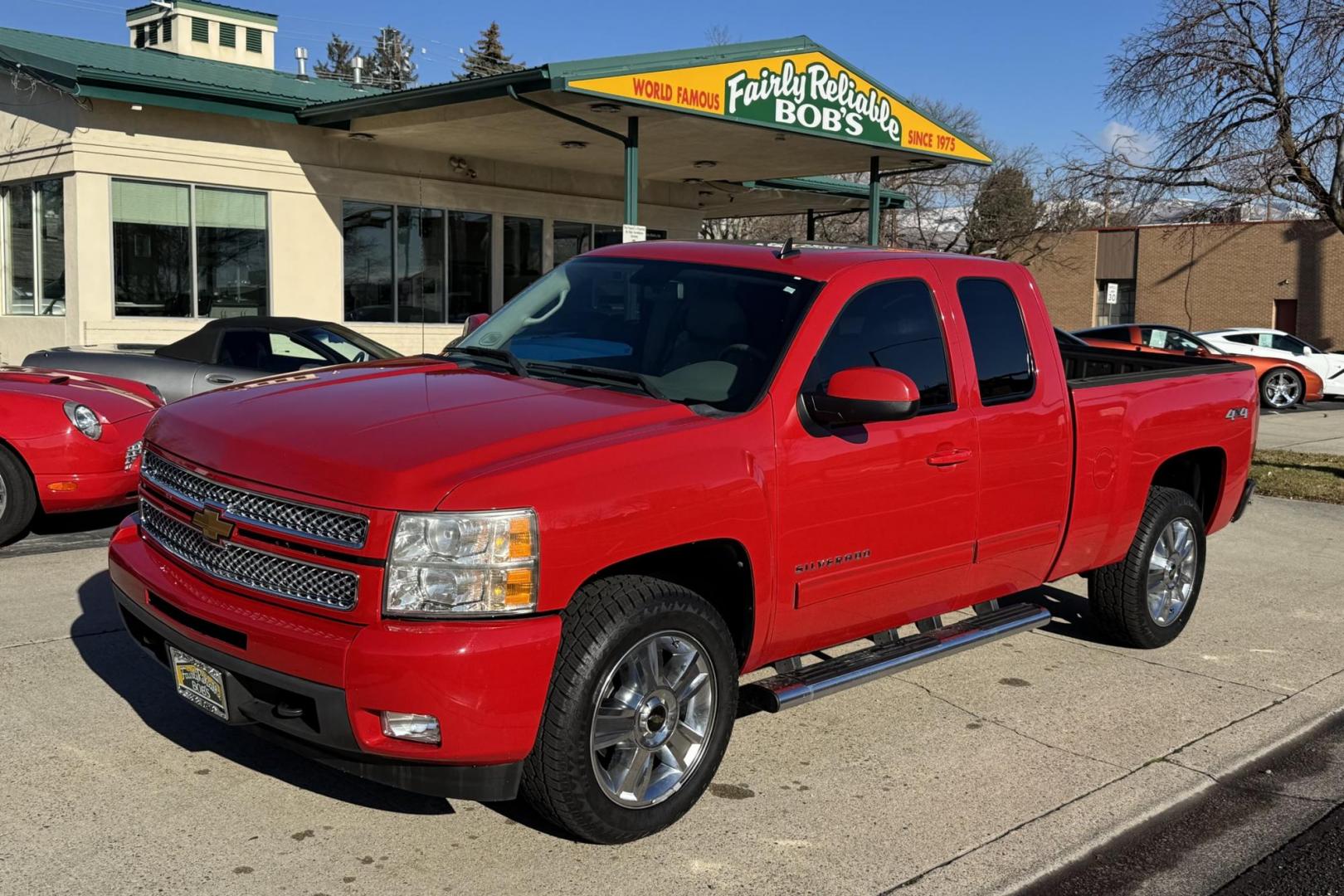 2012 Victory Red /Gray Chevrolet Silverado 1500 Extended Cab LTZ (1GCRKTE72CZ) with an V8 5.3 Liter engine, Automatic 6 Speed transmission, located at 2304 W. Main St., Boise, ID, 83702, (208) 342-7777, 43.622105, -116.218658 - Financing Available O.A.C. - Photo#0