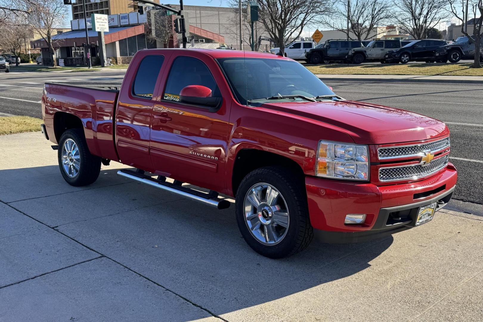 2012 Victory Red /Gray Chevrolet Silverado 1500 Extended Cab LTZ (1GCRKTE72CZ) with an V8 5.3 Liter engine, Automatic 6 Speed transmission, located at 2304 W. Main St., Boise, ID, 83702, (208) 342-7777, 43.622105, -116.218658 - Financing Available O.A.C. - Photo#2