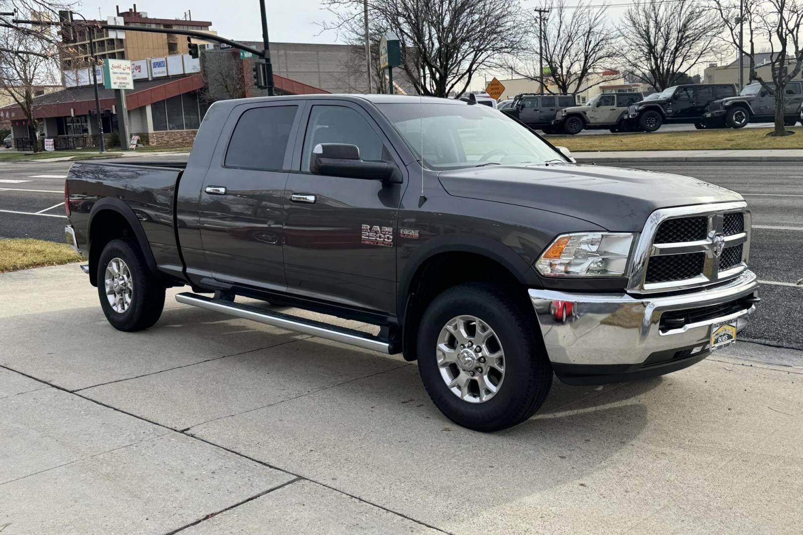 2014 Granite Crystal Metallic Clearcoat /Gray RAM 2500 Mega Cab SLT (3C6UR5MJ2EG) with an V8 6.4 liter engine, Automatic 6 Speed transmission, located at 2304 W. Main St., Boise, ID, 83702, (208) 342-7777, 43.622105, -116.218658 - Updated Stinger Audio! Apple Car Play/Android Auto! - Photo#2