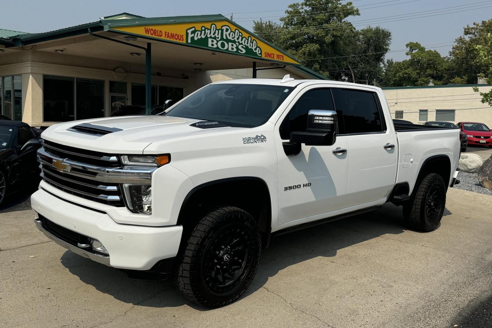 2021 Summit White /Brown/Black Chevrolet Silverado 3500HD High Country High Country Crew Cab (1GC4YVEY9MF) with an V8 6.6 liter Turbo-Diesel engine, Automatic transmission, located at 2304 W. Main St., Boise, ID, 83702, (208) 342-7777, 43.622105, -116.218658 - Magnificent Truck! Ready To Haul! Power Running Boards Too! - Photo#0