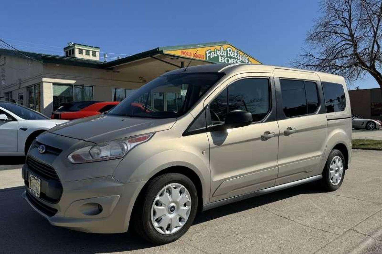 2014 Tectonic Silver Metallic /Gray FORD TRANSIT CONNECT WAGON XLT (NM0GS9F74E1) with an 2.5L DURATEC I4 engine, 6-Speed SelectShift Automatic transmission, located at 2304 W. Main St., Boise, ID, 83702, (208) 342-7777, 43.622105, -116.218658 - Photo#0