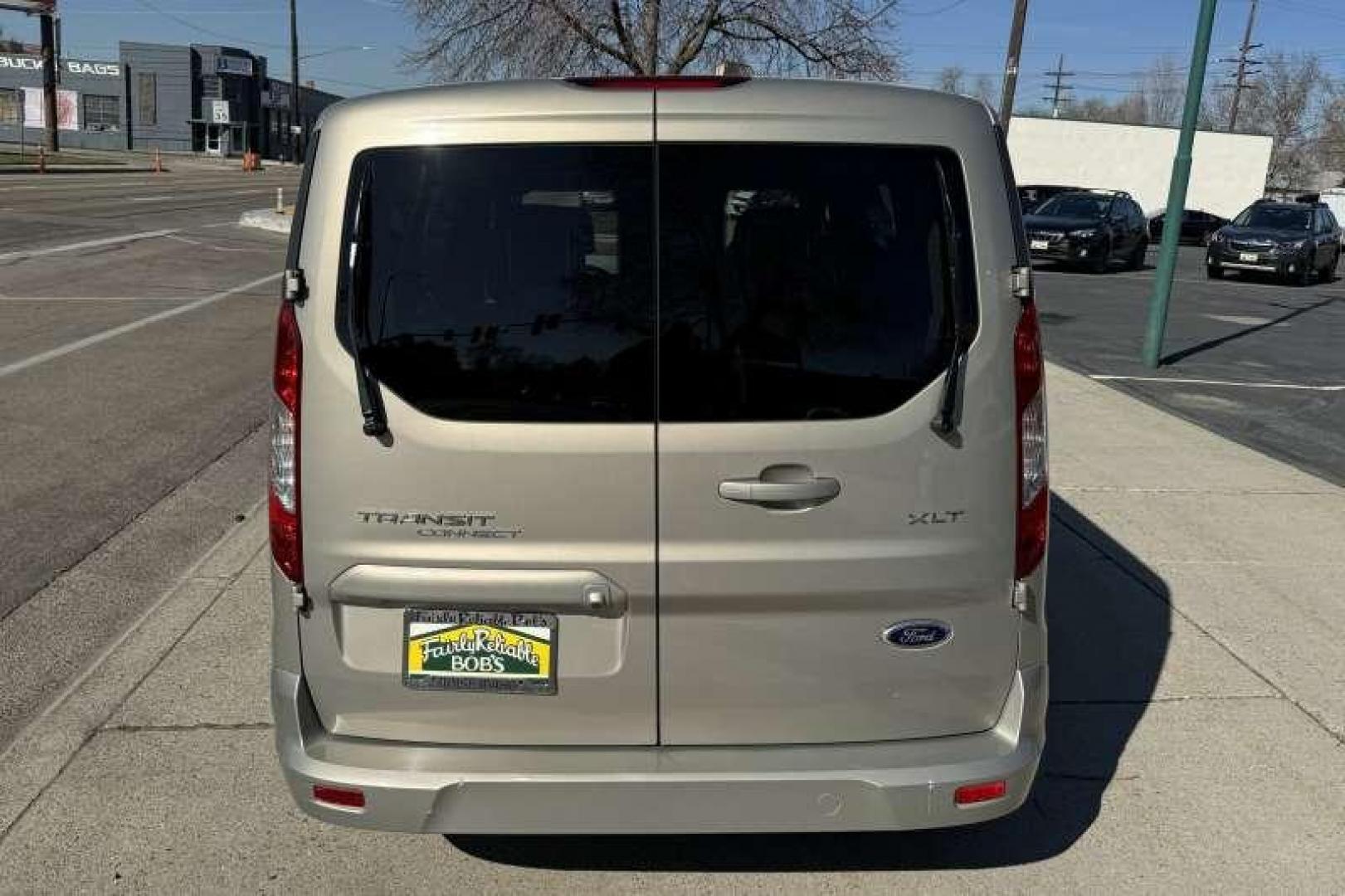 2014 Tectonic Silver Metallic /Gray FORD TRANSIT CONNECT WAGON XLT (NM0GS9F74E1) with an 2.5L DURATEC I4 engine, 6-Speed SelectShift Automatic transmission, located at 2304 W. Main St., Boise, ID, 83702, (208) 342-7777, 43.622105, -116.218658 - Photo#2