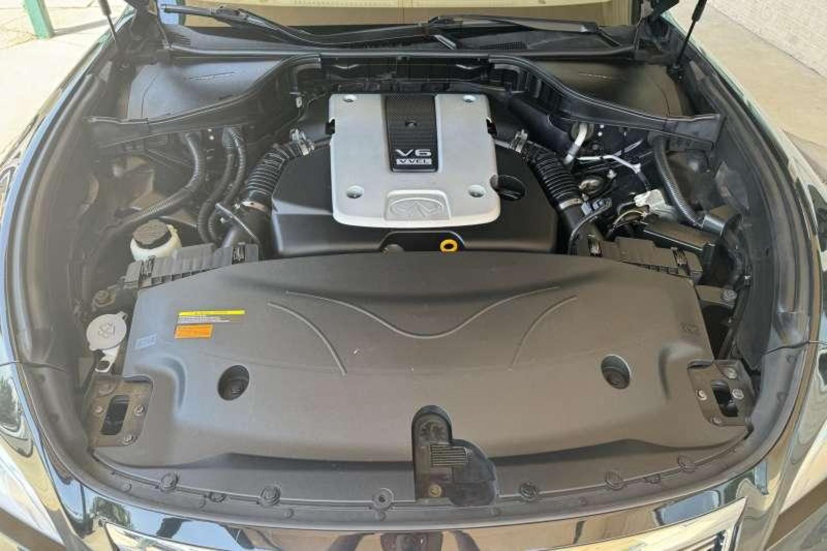 2013 Black /Tan Infiniti M37 Premium (JN1BY1AR3DM) with an 3.7L DOHC 24-valve aluminum-alloy V6 engine engine, Automatic 7 Speed transmission, located at 2304 W. Main St., Boise, ID, 83702, (208) 342-7777, 43.622105, -116.218658 - 2013 INFINITI - Photo#16