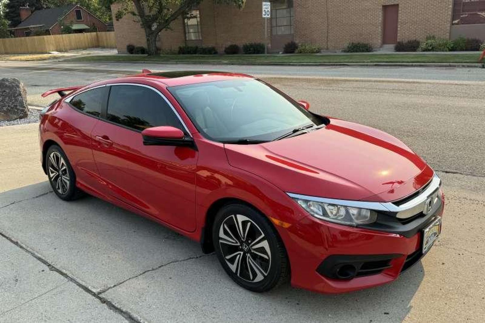 2016 Rallye Red /Black Honda Civic Coupe EX-T (2HGFC3B38GH) with an 4 Cyl 1.5 Liter Turbo engine, Automatic transmission, located at 2304 W. Main St., Boise, ID, 83702, (208) 342-7777, 43.622105, -116.218658 - Photo#2