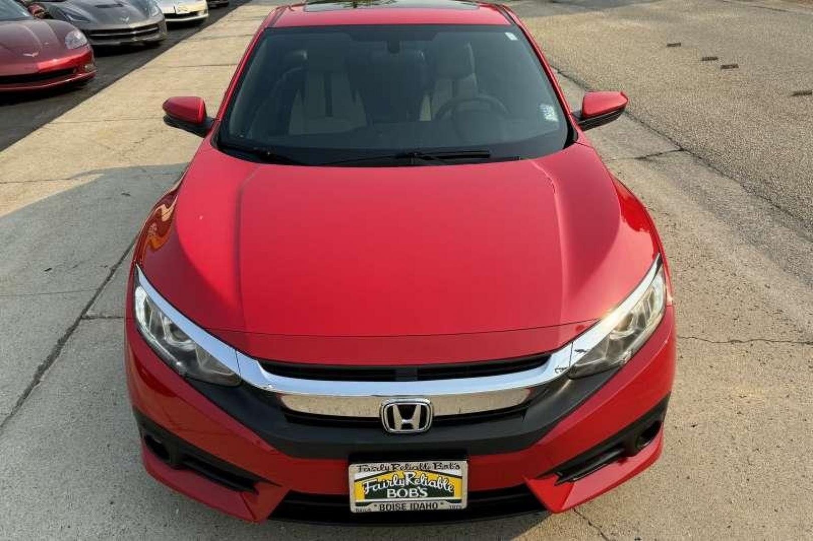 2016 Rallye Red /Black Honda Civic Coupe EX-T (2HGFC3B38GH) with an 4 Cyl 1.5 Liter Turbo engine, Automatic transmission, located at 2304 W. Main St., Boise, ID, 83702, (208) 342-7777, 43.622105, -116.218658 - Photo#3