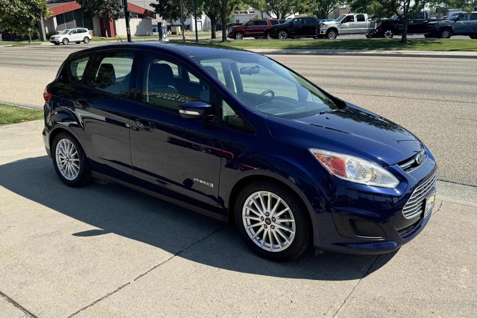 2016 Blue /Gray Ford C-Max Hybrid SE (1FADP5AU7GL) with an 4 Cyl 2.0 Liter Hybrid engine, Automatic transmission, located at 2304 W. Main St., Boise, ID, 83702, (208) 342-7777, 43.622105, -116.218658 - 2016 Ford C-Max Hybrid SE Hatchback - Photo#1