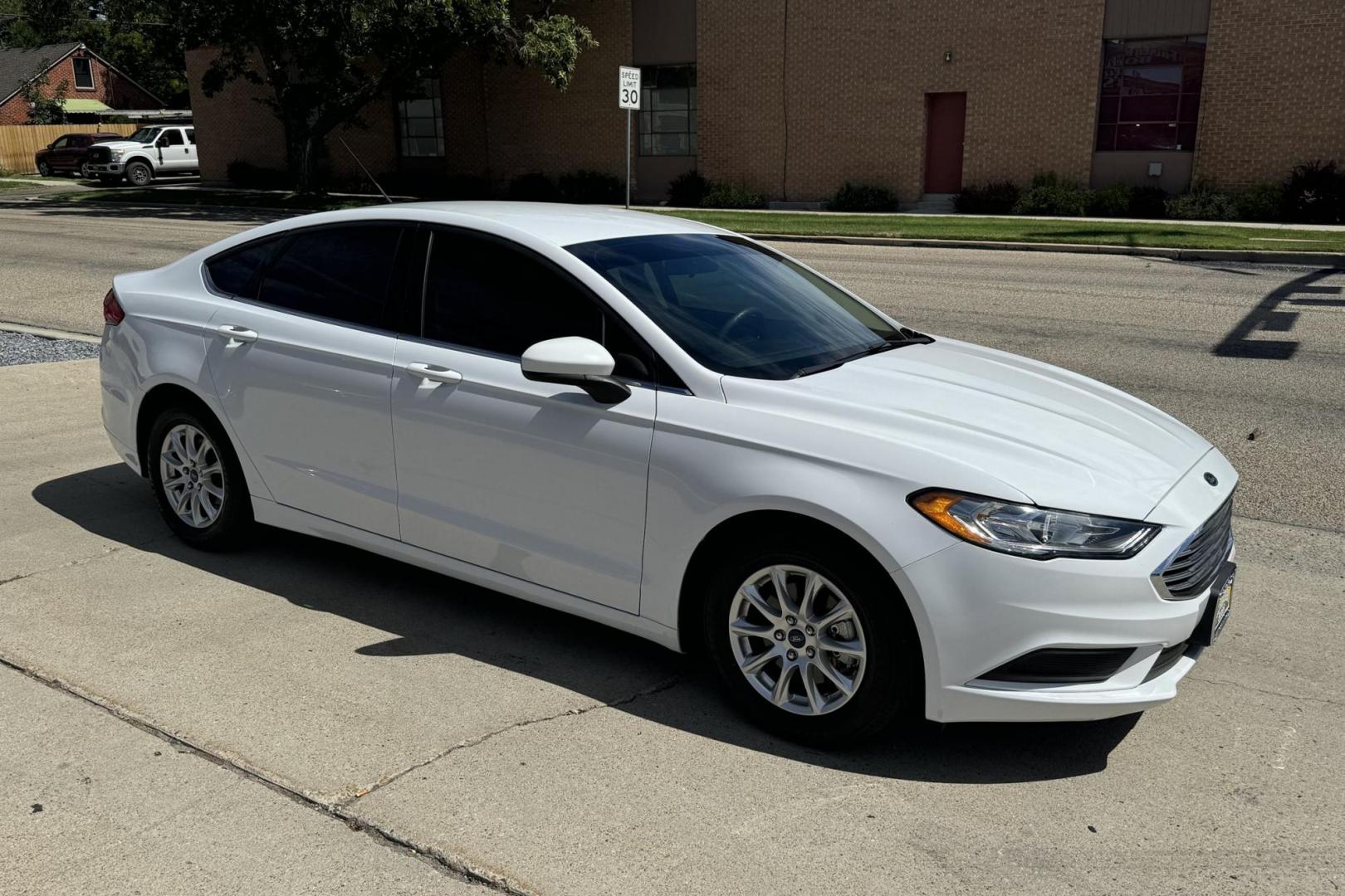 2018 Oxford White /Canvas Ford Fusion (3FA6P0G77JR) with an 4 Cyl 2.5 Liter engine, Automatic transmission, located at 2304 W. Main St., Boise, ID, 83702, (208) 342-7777, 43.622105, -116.218658 - Low Mileage, New Tires, Ready To Go! - Photo#1