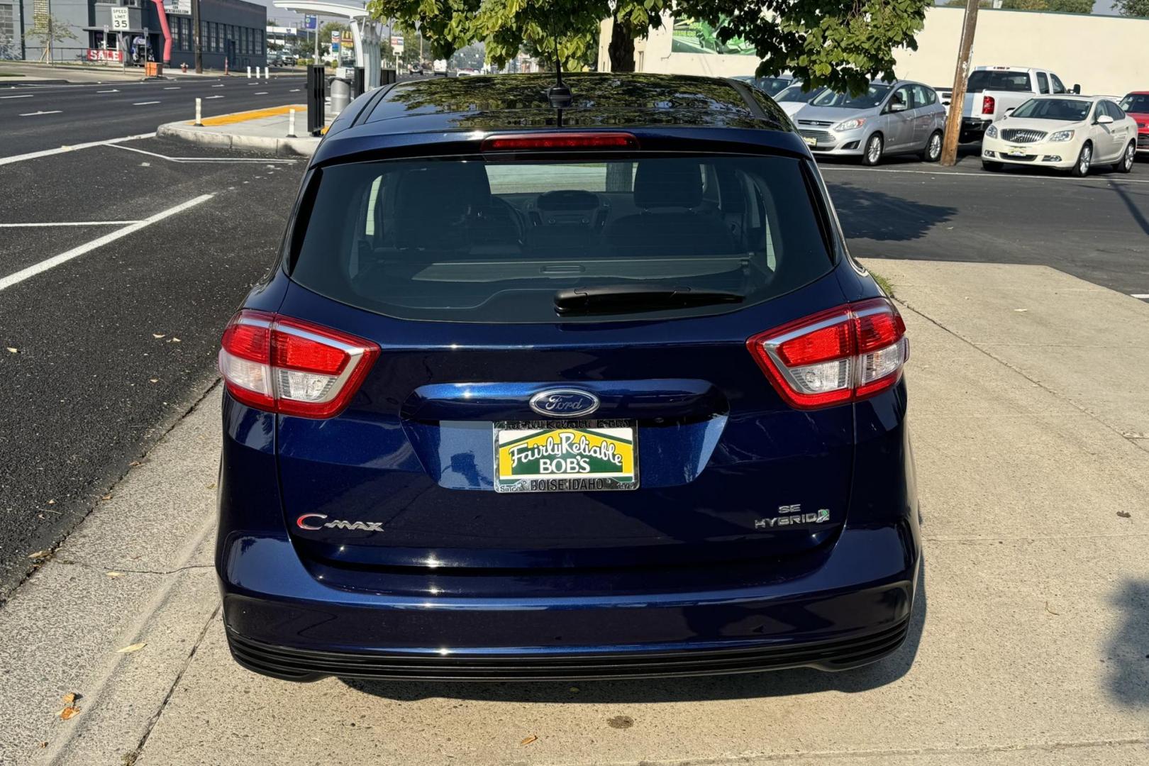 2017 Kona Blue /Black/Gray Ford C-Max Hybrid SE (1FADP5AU4HL) with an 4 Cyl 2.0 Liter Hybrid engine, Automatic transmission, located at 2304 W. Main St., Boise, ID, 83702, (208) 342-7777, 43.622105, -116.218658 - Enjoy Great Fuel Economy, Power And Comfort! - Photo#2