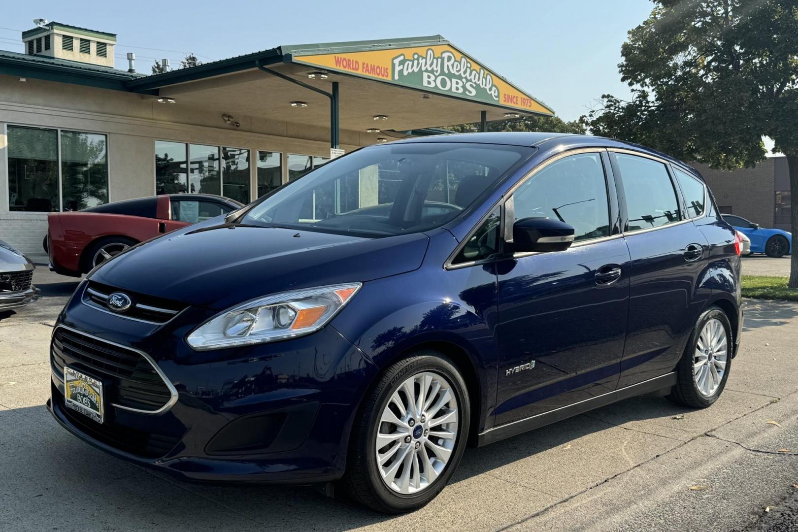 2017 Kona Blue /Black/Gray Ford C-Max Hybrid SE (1FADP5AU4HL) with an 4 Cyl 2.0 Liter Hybrid engine, Automatic transmission, located at 2304 W. Main St., Boise, ID, 83702, (208) 342-7777, 43.622105, -116.218658 - Enjoy Great Fuel Economy, Power And Comfort! - Photo#0