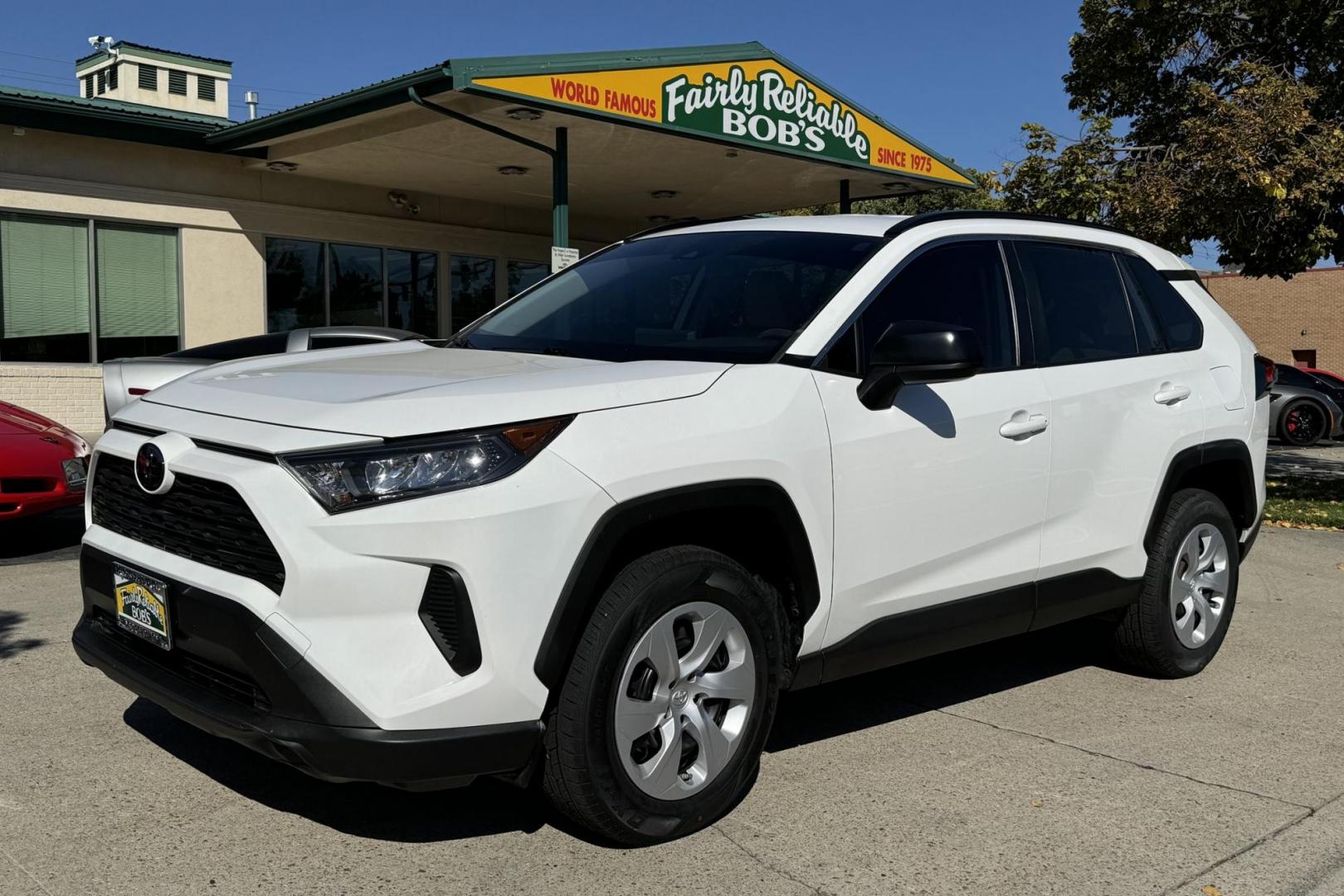 2019 Super White /Light Oak Toyota RAV4 LE (JTMH1RFV1KJ) with an 4 Cyl 2.5 Liter engine, Automatic 8 Speed transmission, located at 2304 W. Main St., Boise, ID, 83702, (208) 342-7777, 43.622105, -116.218658 - New Tires! Great Fuel Economy! - Photo#0