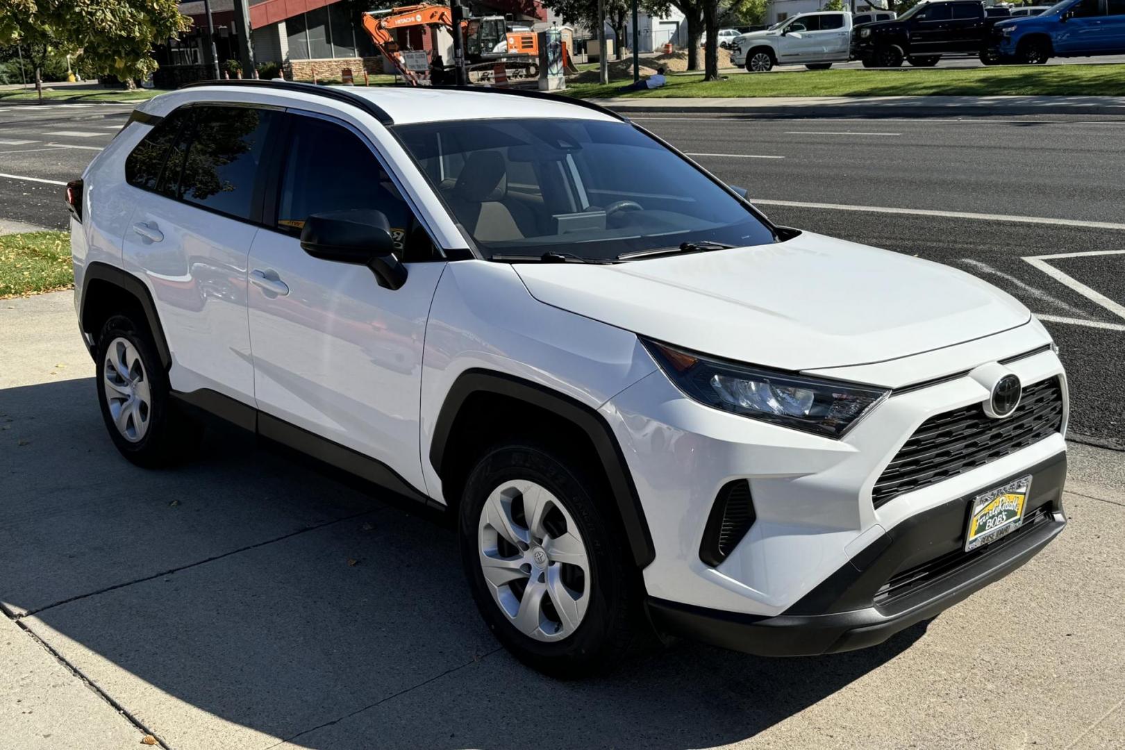 2019 Super White /Light Oak Toyota RAV4 LE (JTMH1RFV1KJ) with an 4 Cyl 2.5 Liter engine, Automatic 8 Speed transmission, located at 2304 W. Main St., Boise, ID, 83702, (208) 342-7777, 43.622105, -116.218658 - New Tires! Great Fuel Economy! - Photo#2