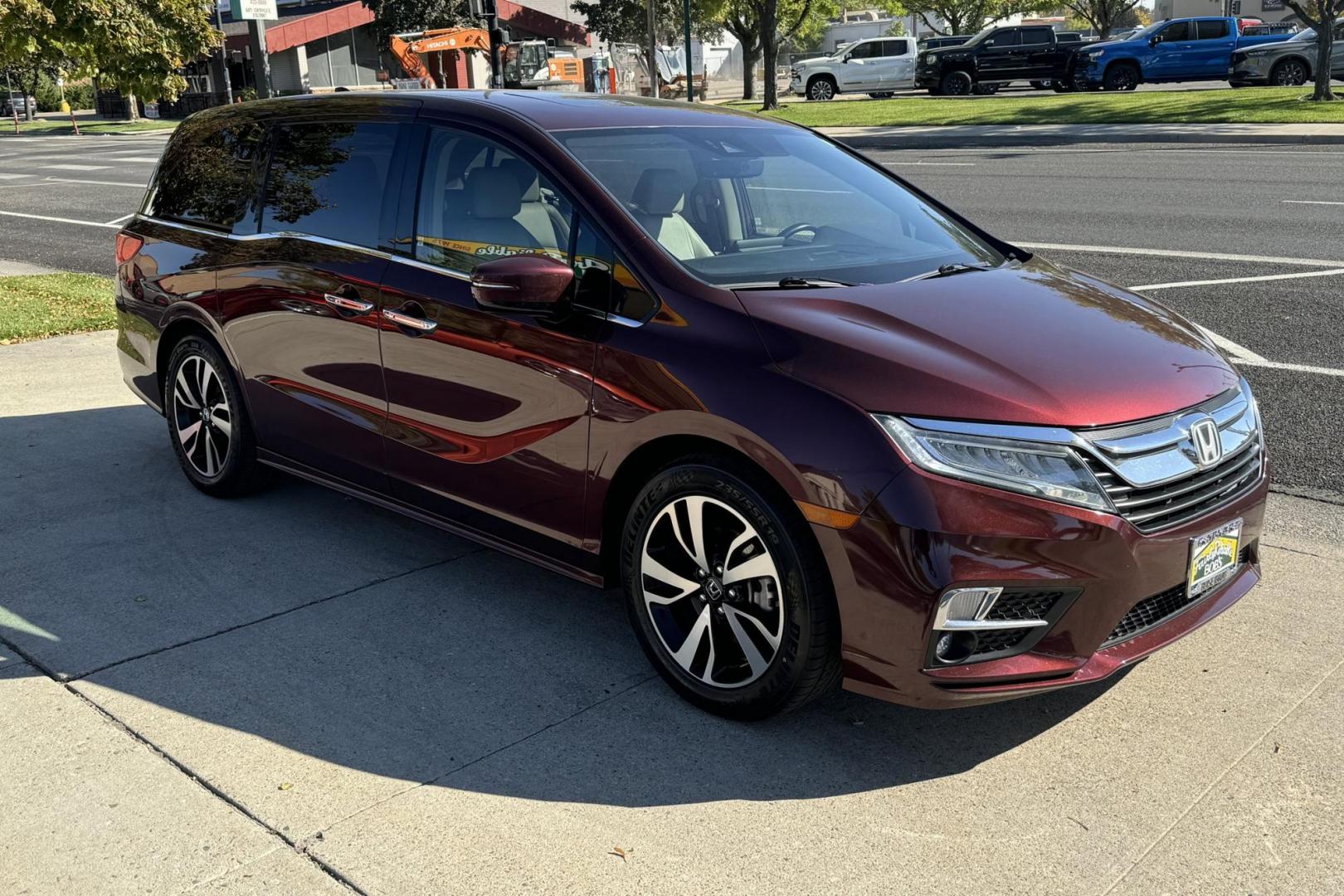 2019 Radiant Red Metallic /Light Oak Honda Odyssey Elite (5FNRL6H94KB) with an V6 3.5 Liter engine, Automatic 10 Speed transmission, located at 2304 W. Main St., Boise, ID, 83702, (208) 342-7777, 43.622105, -116.218658 - Hauls 8 People And Will Entertain The Passengers With A Factory Blu Ray DVD System. - Photo#2