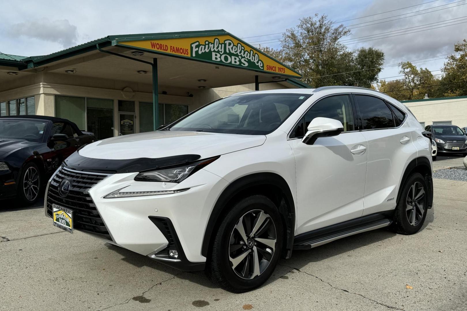 2020 Eminent White Pearl /Red Lexus NX 300H Luxury (JTJHJRDZ4L5) with an 4 Cyl 2.5 Liter Hybrid engine, Automatic transmission, located at 2304 W. Main St., Boise, ID, 83702, (208) 342-7777, 43.622105, -116.218658 - Great Fuel Economy! Amazing Comfort! - Photo#0