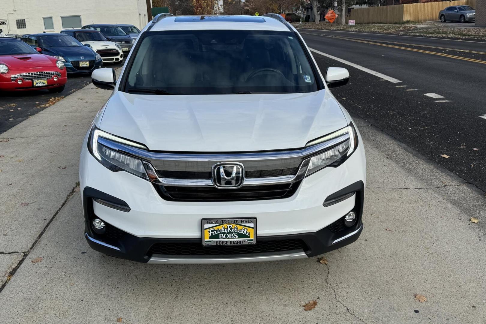 2021 Platinum White Pearl /Black Honda Pilot Touring (5FNYF6H96MB) with an V6 3.5 Liter engine, Automatic 9 Speed transmission, located at 2304 W. Main St., Boise, ID, 83702, (208) 342-7777, 43.622105, -116.218658 - Photo#1