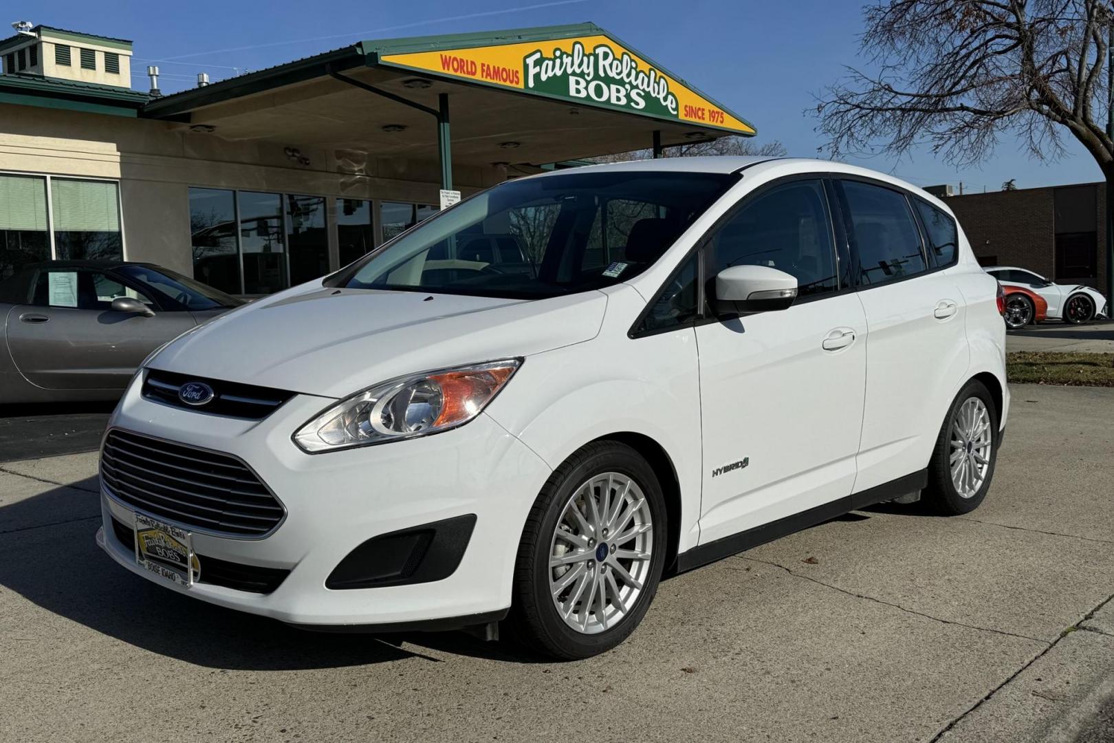 2016 Oxford White /Gray Ford C-Max Hybrid SE (1FADP5AU2GL) with an 4 Cyl 2.0 Liter Hybrid engine, Automatic transmission, located at 2304 W. Main St., Boise, ID, 83702, (208) 342-7777, 43.622105, -116.218658 - Updated JVC Head Unit! Power Rear Liftgate! Apple Car Play! - Photo#0