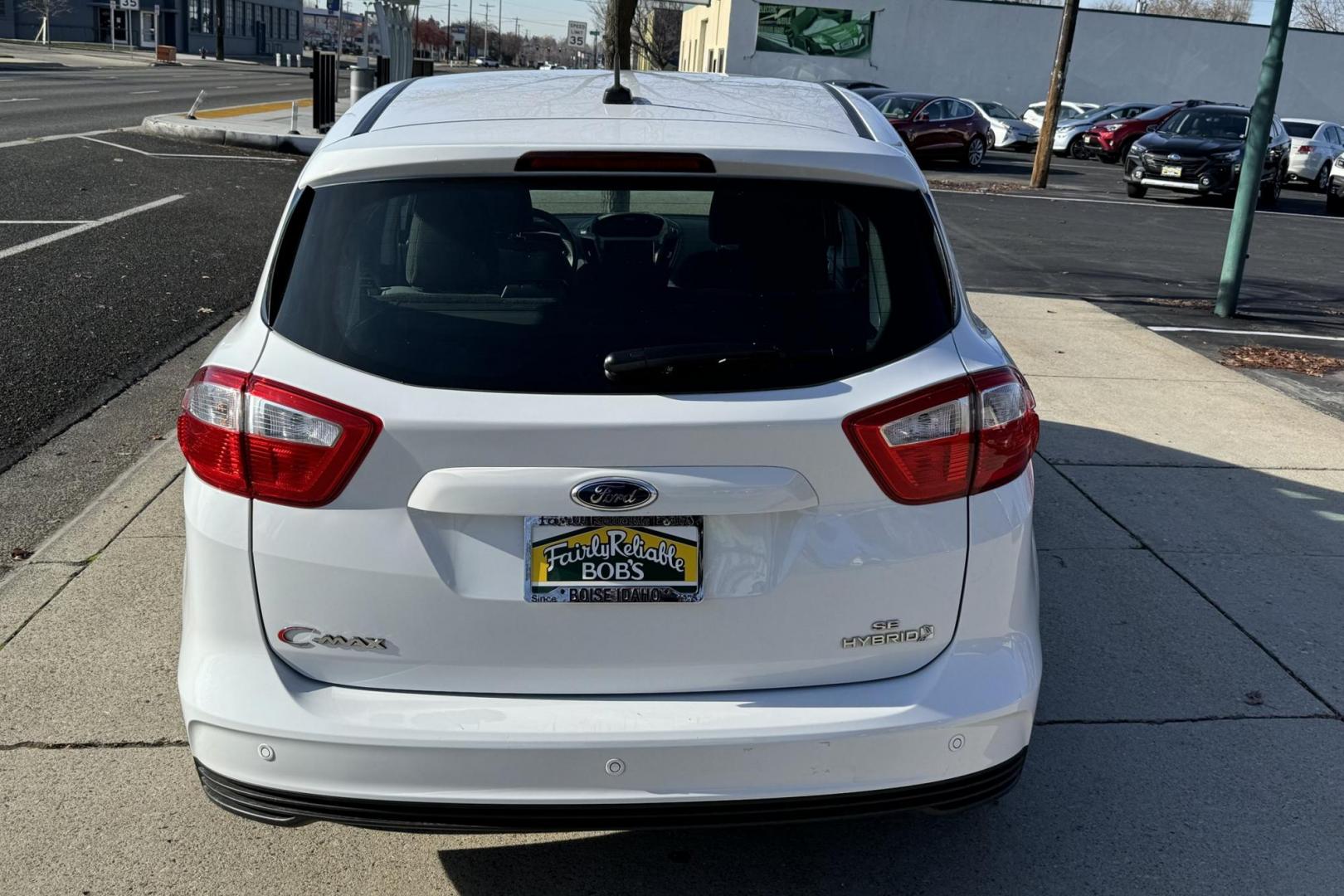 2016 Oxford White /Gray Ford C-Max Hybrid SE (1FADP5AU2GL) with an 4 Cyl 2.0 Liter Hybrid engine, Automatic transmission, located at 2304 W. Main St., Boise, ID, 83702, (208) 342-7777, 43.622105, -116.218658 - Updated JVC Head Unit! Power Rear Liftgate! Apple Car Play! - Photo#2