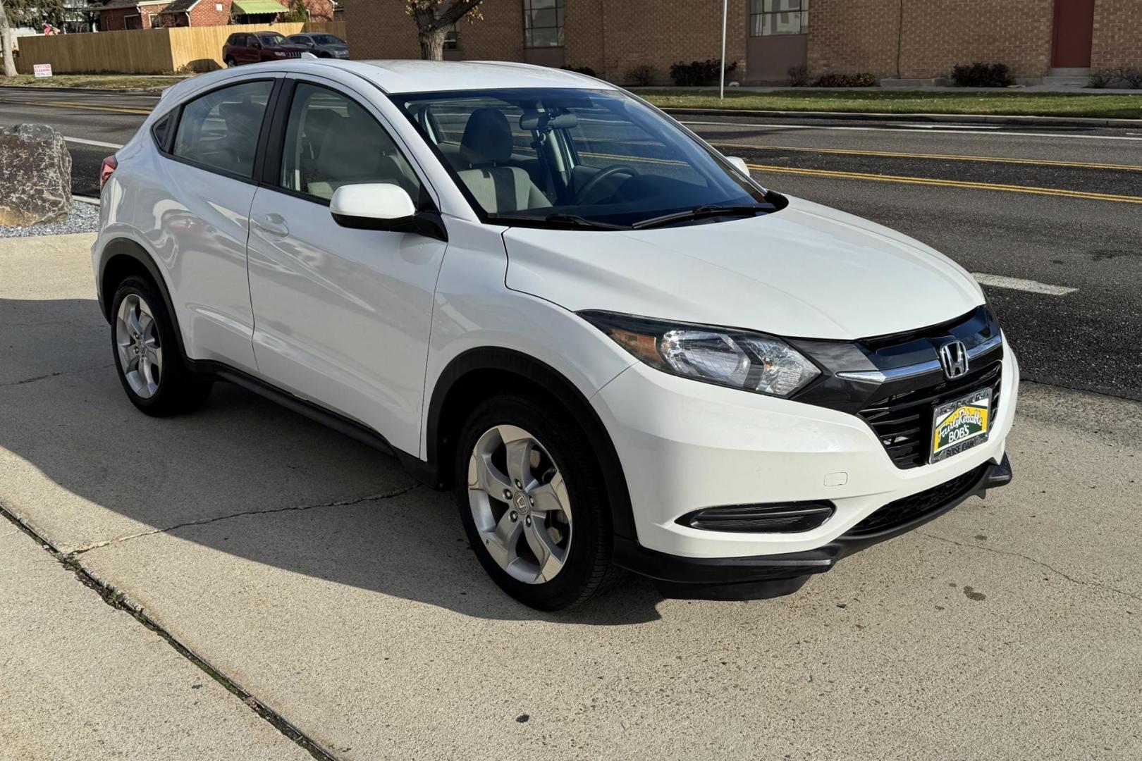 2016 White /Gray Honda HR-V LX (3CZRU6H32GM) with an 4 Cyl 1.8 Liter engine, Automatic transmission, located at 2304 W. Main St., Boise, ID, 83702, (208) 342-7777, 43.622105, -116.218658 - Great Fuel Economy And All Wheel Drive! - Photo#1