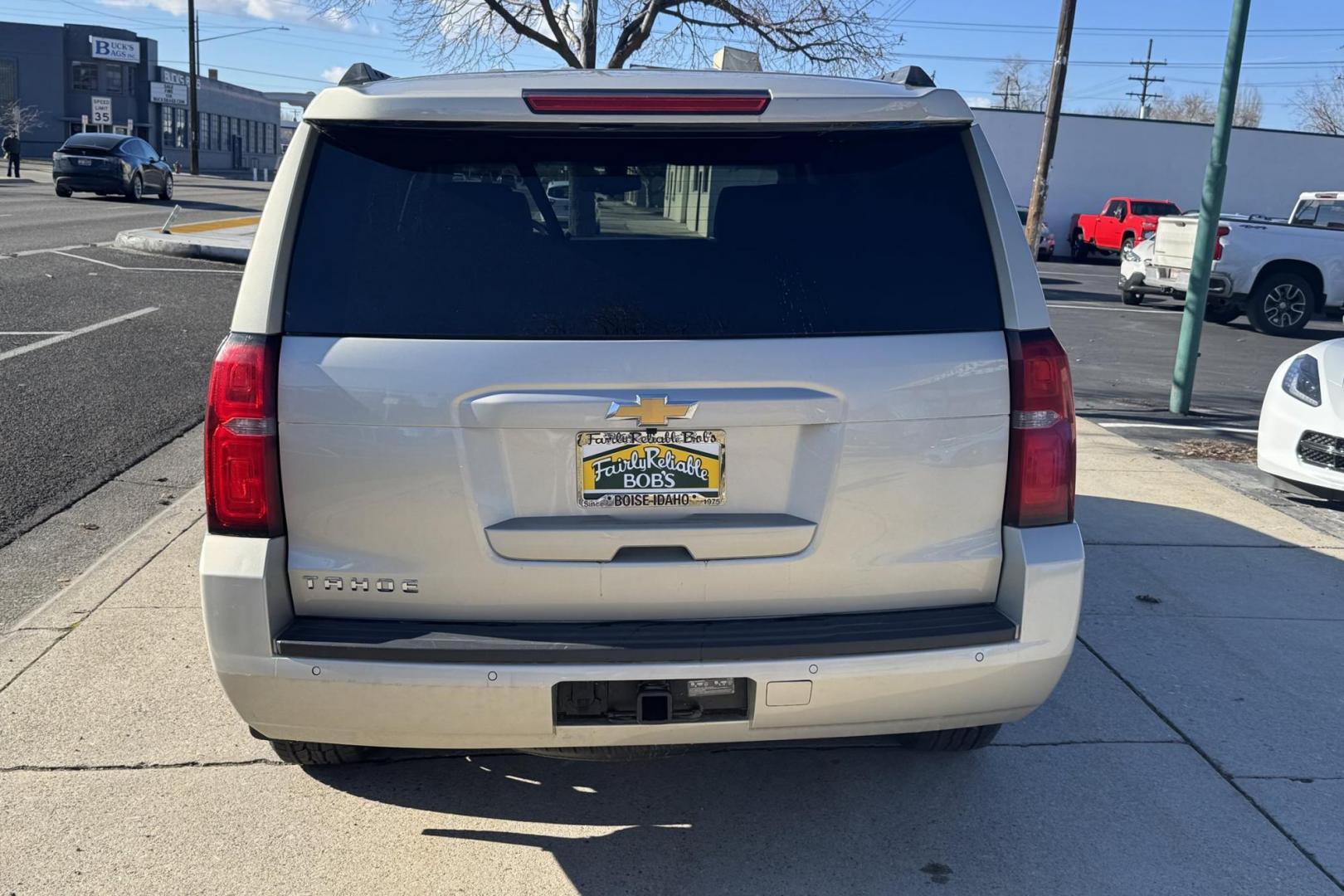 2015 Champagne Silver Metallic /Cocoa/Dune Chevrolet Tahoe LS (1GNSKAKC6FR) with an V8 5.3 Liter engine, Automatic 6 Speed transmission, located at 2304 W. Main St., Boise, ID, 83702, (208) 342-7777, 43.622105, -116.218658 - Low Mileage And Seats 8! - Photo#1