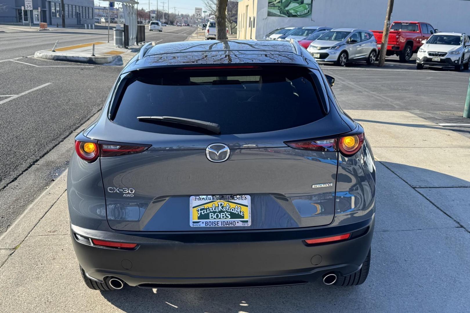 2024 Polymetal Gray Metallic /Red Leather Mazda CX-30 2.5 S Carbon Edition (3MVDMBCM4RM) with an 4 Cyl 2.5 Liter engine, Automatic 6 Speed transmission, located at 2304 W. Main St., Boise, ID, 83702, (208) 342-7777, 43.622105, -116.218658 - A lot of remaining factory warranty! New Tires Too! - Photo#1