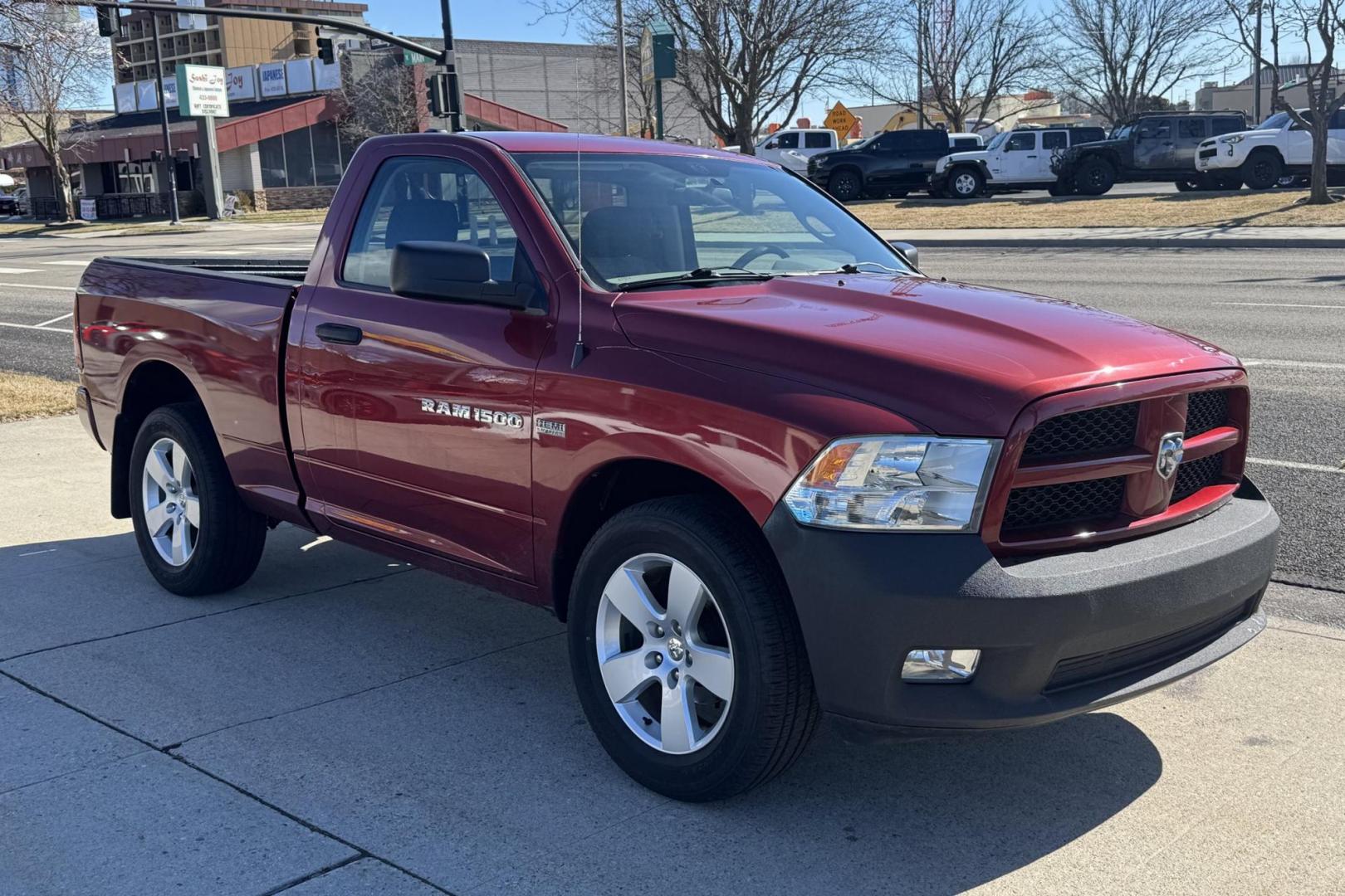 2012 Maroon /Black RAM 1500 Express (3C6JD7AT6CG) with an V8 5.7 Liter Hemi engine, Automatic transmission, located at 2304 W. Main St., Boise, ID, 83702, (208) 342-7777, 43.622105, -116.218658 - Hard To Find Regular Cab Short Box 4x4! - Photo#2