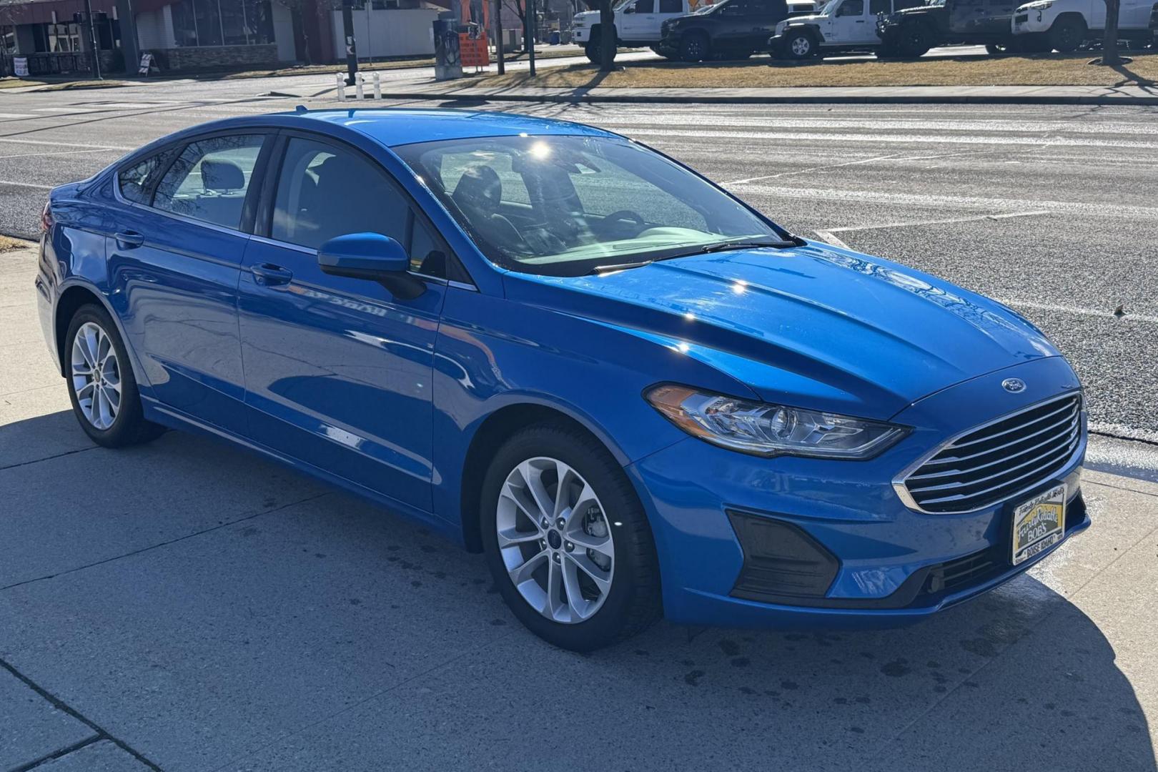 2020 Velocity Blue /Black Ford Fusion Hybrid SE (3FA6P0LU7LR) with an 4 Cyl 2.0 Liter Hybrid engine, Automatic transmission, located at 2304 W. Main St., Boise, ID, 83702, (208) 342-7777, 43.622105, -116.218658 - Low Mileage And Great Fuel Economy! - Photo#2