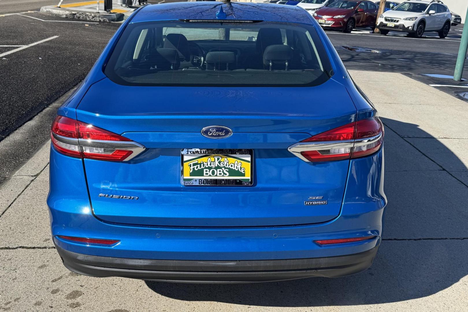 2020 Velocity Blue /Black Ford Fusion Hybrid SE (3FA6P0LU7LR) with an 4 Cyl 2.0 Liter Hybrid engine, Automatic transmission, located at 2304 W. Main St., Boise, ID, 83702, (208) 342-7777, 43.622105, -116.218658 - Low Mileage And Great Fuel Economy! - Photo#1