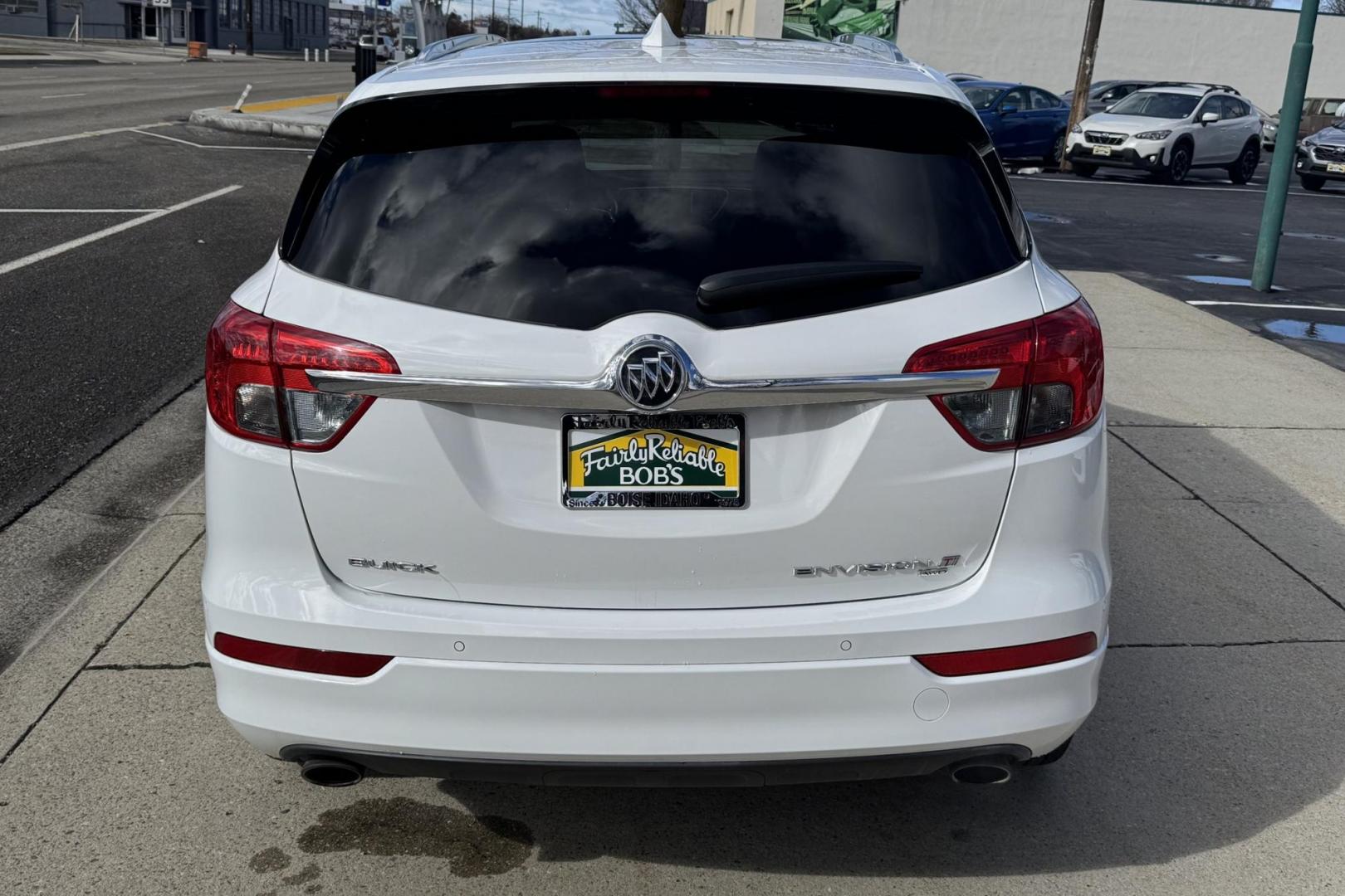 2018 Summit White /Jet Black Buick Envision Premium (LRBFX3SX6JD) with an 4 Cyl 2.0 Liter Turbo engine, Automatic 6 Speed transmission, located at 2304 W. Main St., Boise, ID, 83702, (208) 342-7777, 43.622105, -116.218658 - Well Optioned And Clean! A Lot Of Safety Features Too! - Photo#1